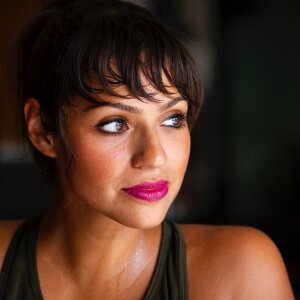 Personal trainer working with a client in a chic Parisian gym, blending fitness and elegance in the city of love